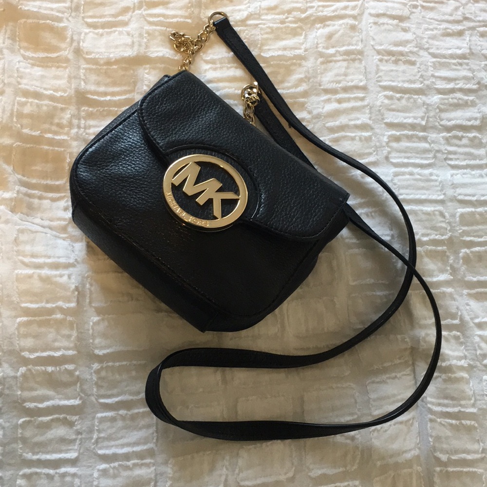 Black and gold Michael Kors cross body bag.